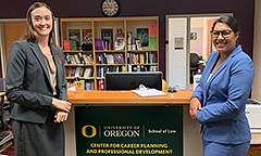 Student and staff member posing for a photo in the law school's career center