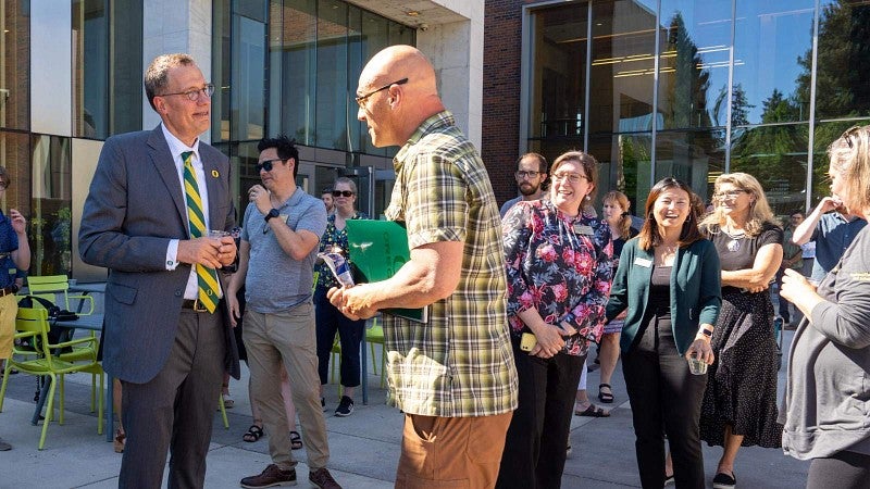 President Scholz greets members of the community during the campus celebration