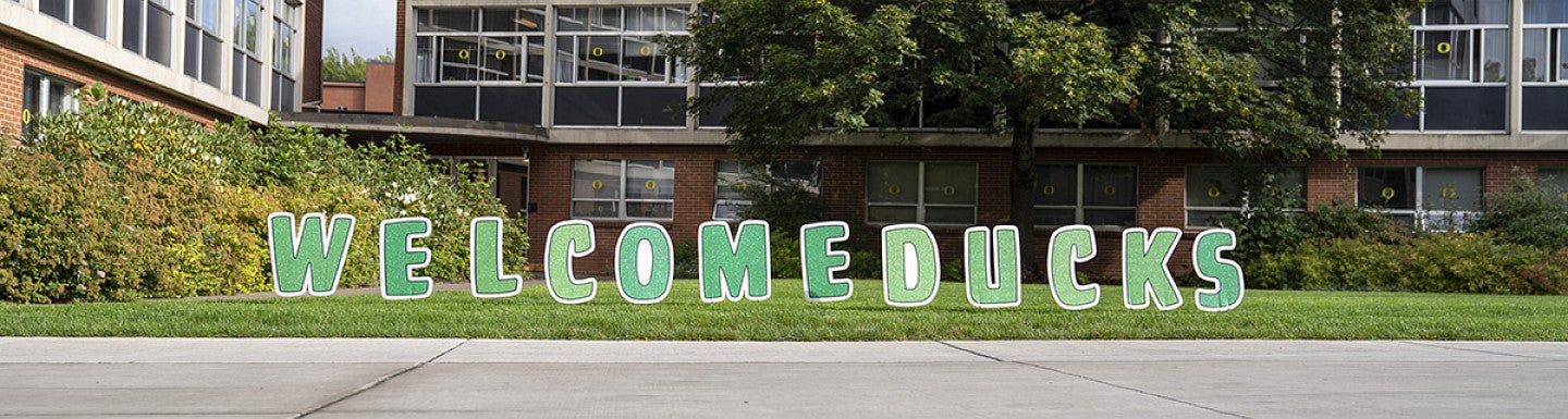 Yard signs welcoming the new Ducks to campus