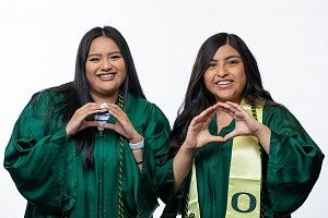 PathwayOregon students throwing the O in their caps and gowns