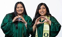 PathwayOregon graduates posing for a photo in their graduation gowns