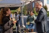 Interim President Patrick Phillips and ASUO Student Body President Luda Isakharov talk with a vendor during the street faire