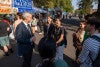 Interim President Patrick Phillips talks with students attending the street faire